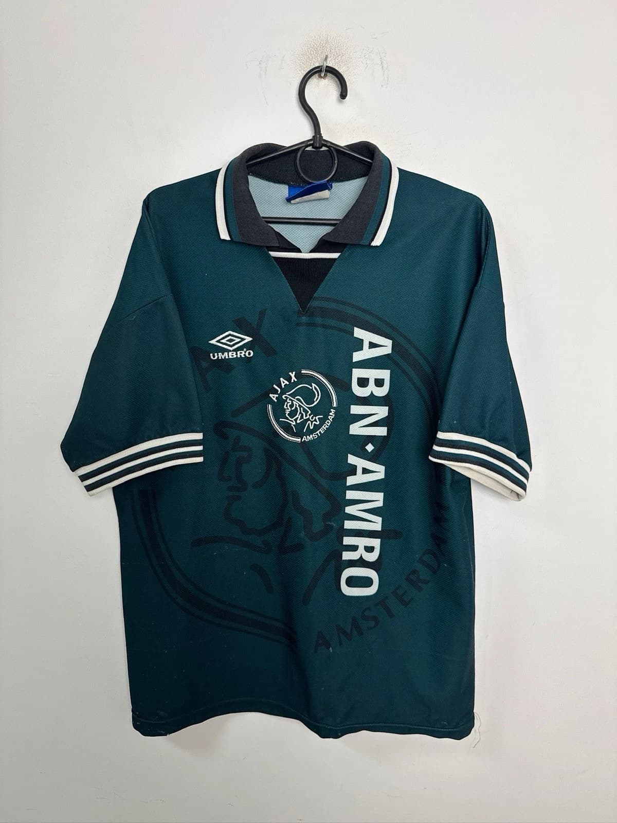 A football shirt showing its fabric, crest and seams